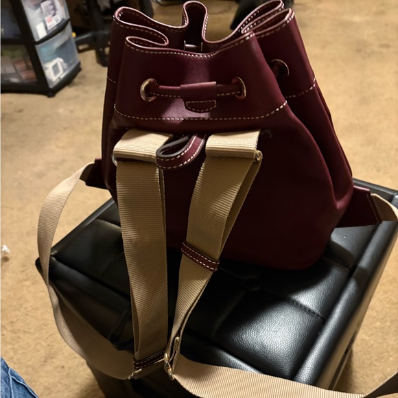 Dooney & Bourke Handbags - Dooney and Burke Drawstringng Backpack in color Grape.